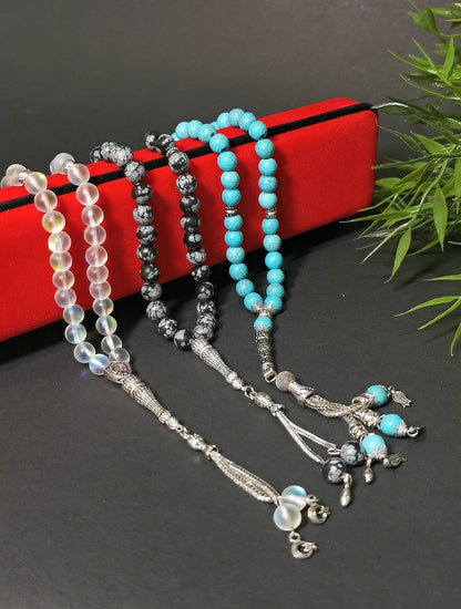Display of three rosaries with 100% natural stones 